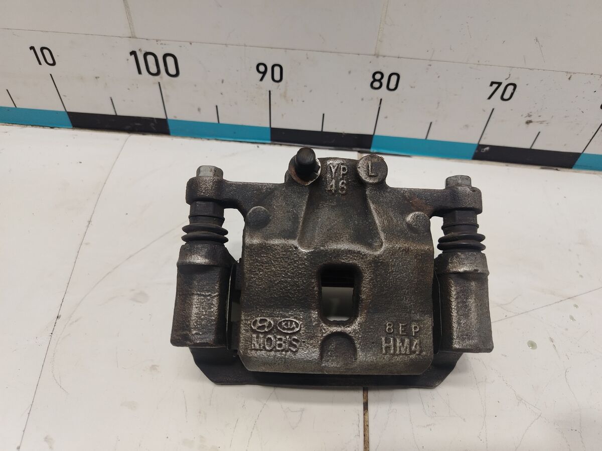 Суппорт тормозной задний левый Kia Carnival (YP) III (2014– н.в.)