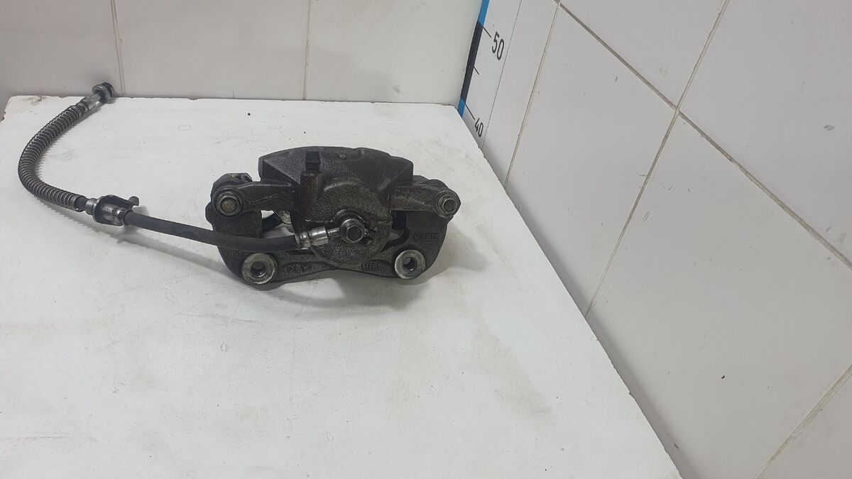 Суппорт тормозной передний левый Kia Cerato IV (2018– н.в.)